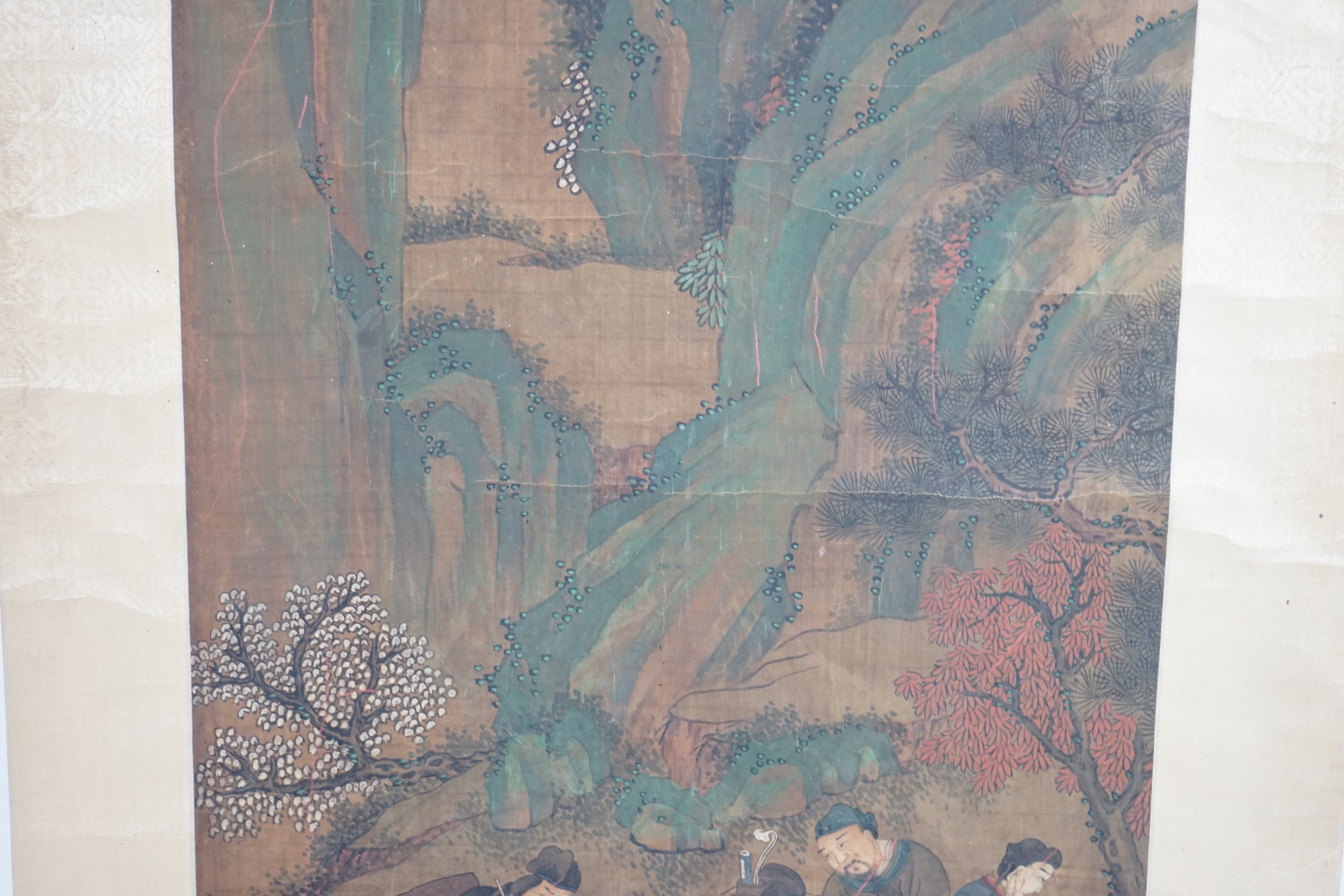 Chinese School, 19th century, scroll painting, ink and colour on silk, scholars in a garden examining a painting